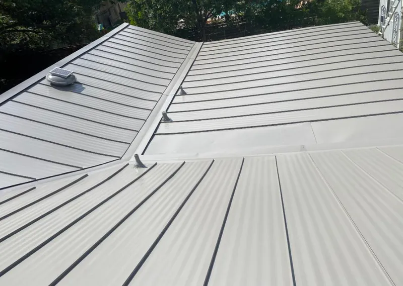 Solar attic fan installed on a metal roof for Roof Ventilation in Gypsum